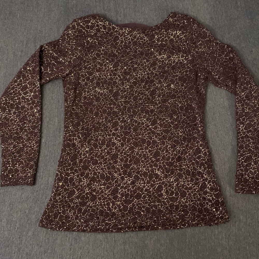 Size medium beautiful embroidered purple blouse.